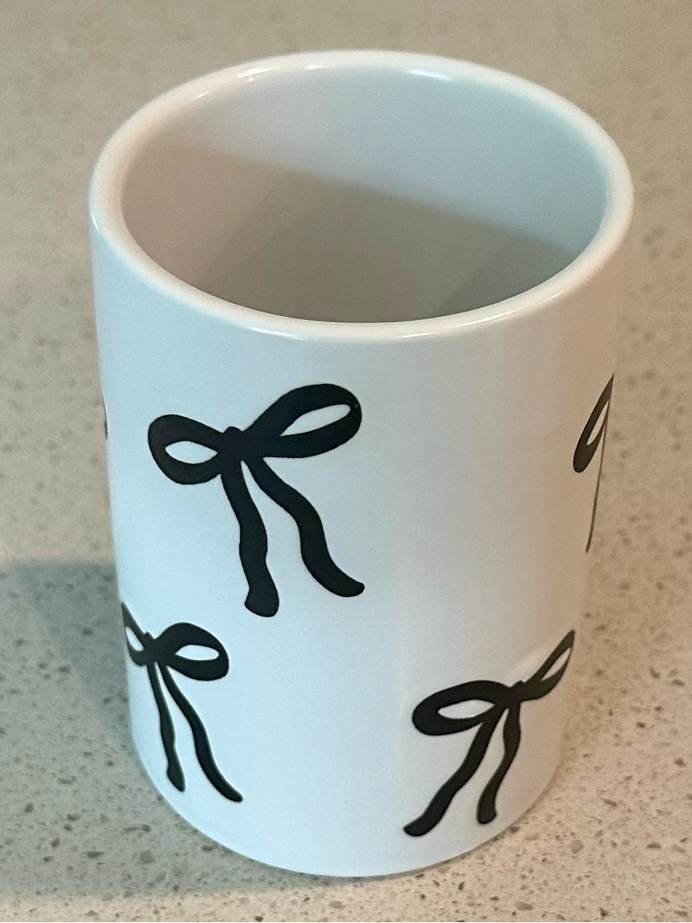 Rachel Zoe White Ceramic Tumbler with Black Bow Motif
